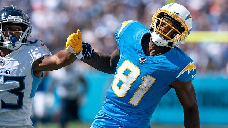 Los Angeles Chargers wide receiver Mike Williams (81) can't catch up to an overthrown pass while defended by Tennessee Titans cornerback Tre Avery (23) during their NFL game at Nissan Stadium Sunday afternoon, Sept. 17, 2023.