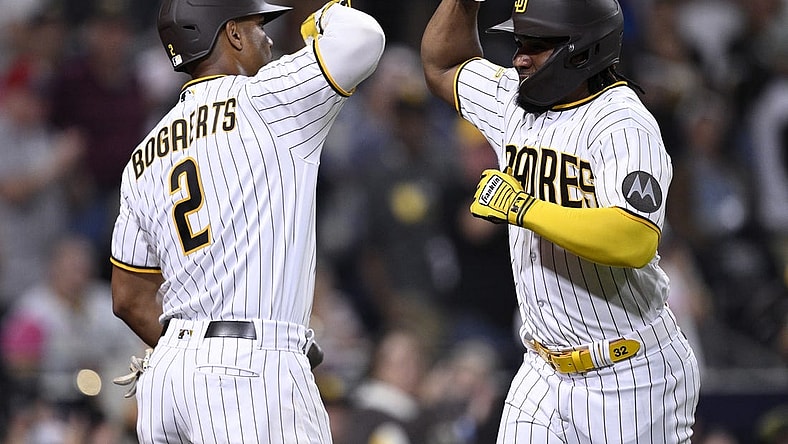 Sep 18, 2023; San Diego, California, USA; San Diego Padres third baseman Eguy Rosario (right) is congratulated by shortstop Xander Bogaerts (2) after hitting a home run against the Colorado Rockies during the third inning at Petco Park. Mandatory Credit: Orlando Ramirez-USA TODAY Sports