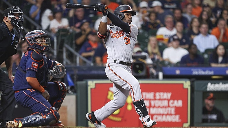 Sep 18, 2023; Houston, Texas, USA; Baltimore Orioles center fielder Cedric Mullins (31) hits a three-run home run during the ninth inning against the Houston Astros at Minute Maid Park. Mandatory Credit: Troy Taormina-USA TODAY Sports