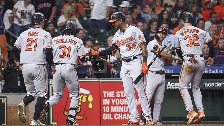 Sep 18, 2023; Houston, Texas, USA; Baltimore Orioles center fielder Cedric Mullins (31) celebrates with right fielder Aaron Hicks (34) after hitting a home run during the ninth inning against the Houston Astros at Minute Maid Park. Mandatory Credit: Troy Taormina-USA TODAY Sports