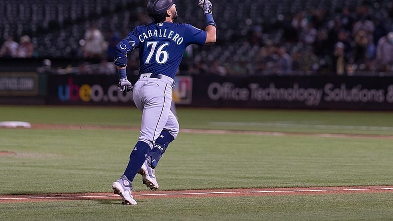 Sep 18, 2023; Oakland, California, USA;  Seattle Mariners second baseman Jose Caballero (76) celebrates after hitting a two run home run during the fourth inning against the Oakland Athletics at Oakland-Alameda County Coliseum. Mandatory Credit: Stan Szeto-USA TODAY Sports