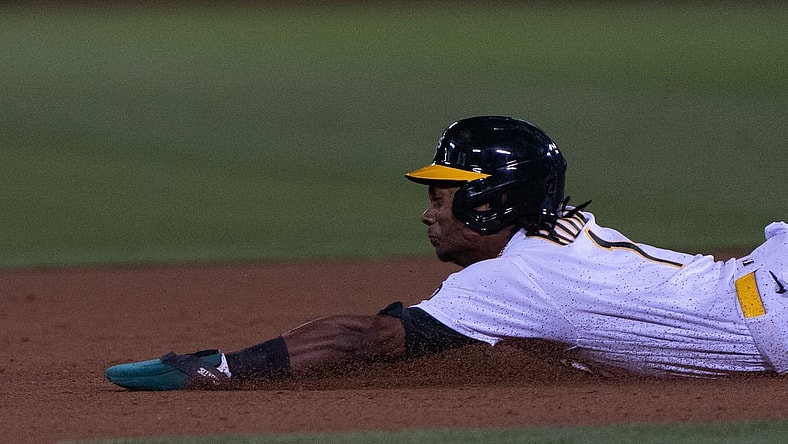 Sep 18, 2023; Oakland, California, USA;  Oakland Athletics center fielder Esteury Ruiz (1) slides during the eighth inning against Seattle Mariners at Oakland-Alameda County Coliseum. Mandatory Credit: Stan Szeto-USA TODAY Sports