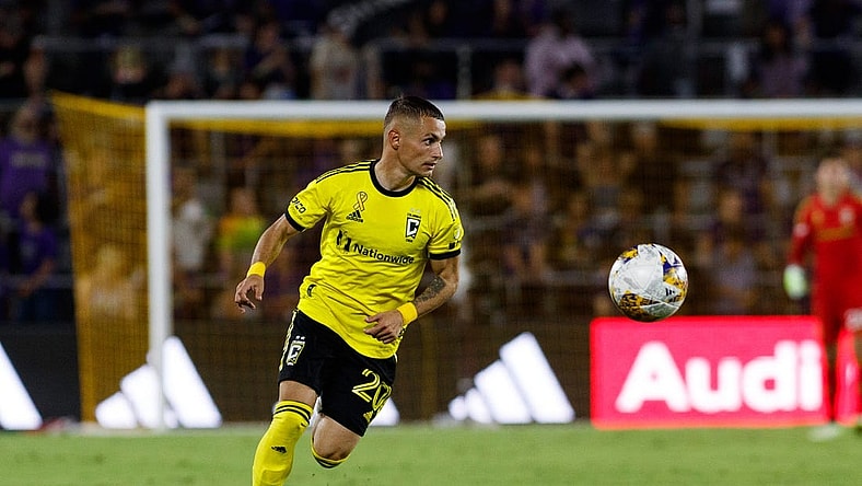 Sep 16, 2023; Orlando, Florida, USA; Columbus Crew midfielder Alexandru Matan (20) chases the ball against Orlando City SC in the second half at Exploria Stadium. Mandatory Credit: Morgan Tencza-USA TODAY Sports