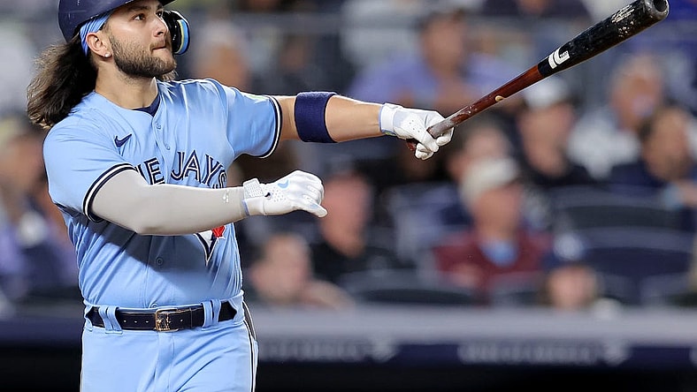 Sep 19, 2023; Bronx, New York, USA; Toronto Blue Jays shortstop Bo Bichette (11) follows through on a two run home run against the New York Yankees during the fifth inning at Yankee Stadium. Mandatory Credit: Brad Penner-USA TODAY Sports
