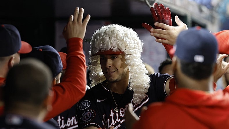 Sep 19, 2023; Washington, District of Columbia, USA; Washington Nationals designated hitter Joey Meneses (45) poses with teammates while wearing the Founding Fathers home run wig after hitting a go ahead three run home run against the Chicago White Sox during the seventh inning at Nationals Park. Mandatory Credit: Geoff Burke-USA TODAY Sports