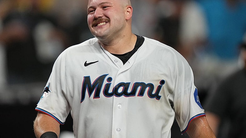 Sep 19, 2023; Miami, Florida, USA;  Miami Marlins third baseman Jake Burger (36) gets dunked by teammates after hitting the game winning RBI single in the ninth inning against the New York Mets at loanDepot Park. Mandatory Credit: Jim Rassol-USA TODAY Sports