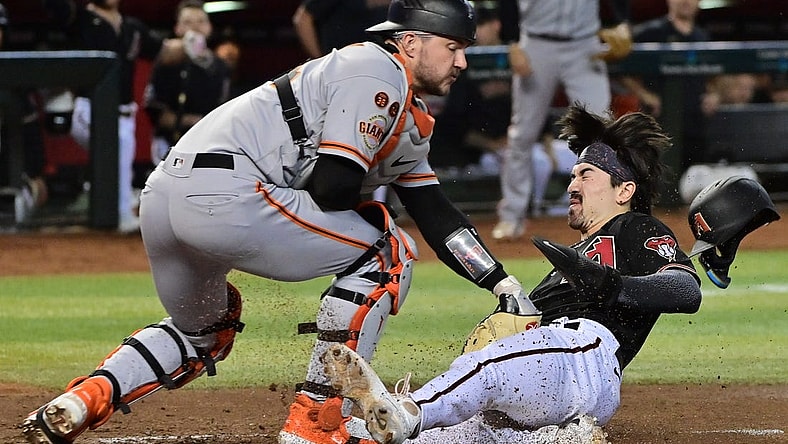 Sep 19, 2023; Phoenix, Arizona, USA; Arizona Diamondbacks left fielder Corbin Carroll (7) scores in the second inning against the San Francisco Giants at Chase Field. Mandatory Credit: Matt Kartozian-USA TODAY Sports