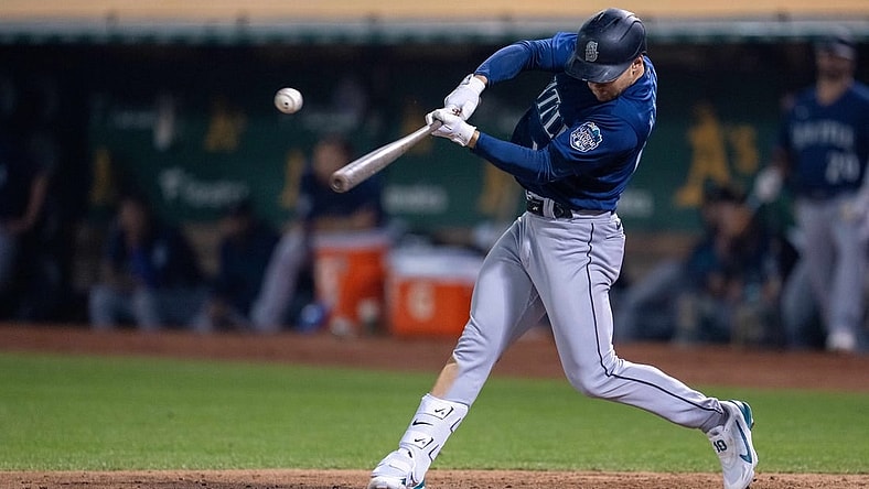 Sep 19, 2023; Oakland, California, USA; Seattle Mariners left fielder Jarred Kelenic (10) hits a RBI single against the Oakland Athletics during the fourth inning at Oakland-Alameda County Coliseum. Mandatory Credit: Neville E. Guard-USA TODAY Sports