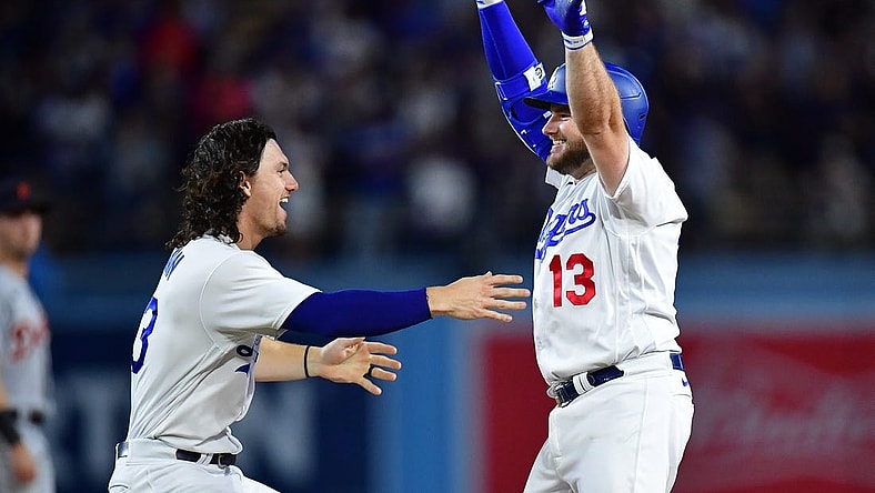 Sep 19, 2023; Los Angeles, California, USA; Los Angeles Dodgers third baseman Max Muncy (13) celebrates with center fielder James Outman (33) after hitting a walk off RBI single against the Detroit Tigers during the ninth inning at Dodger Stadium. Mandatory Credit: Gary A. Vasquez-USA TODAY Sports