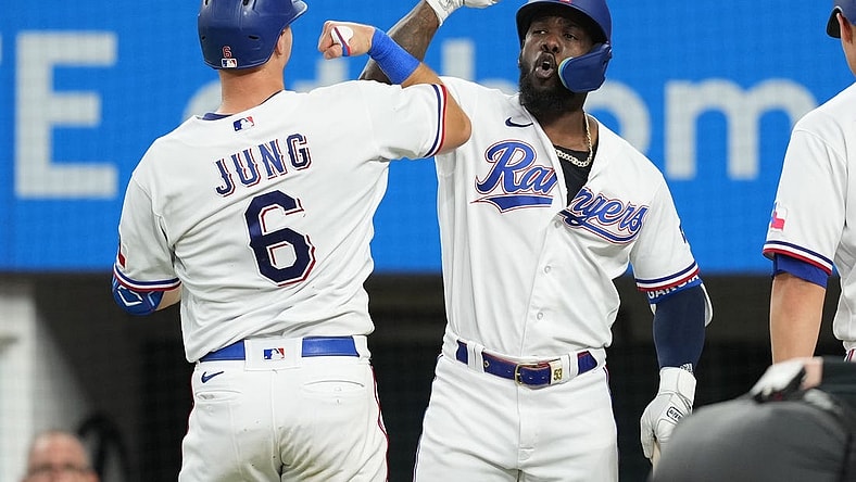 Sep 20, 2023; Arlington, Texas, USA; Texas Rangers third baseman Josh Jung (6) celebrates his solo home run with right fielder Adolis Garcia (53) against the Boston Red Sox during the fifth inning at Globe Life Field. Mandatory Credit: Jim Cowsert-USA TODAY Sports