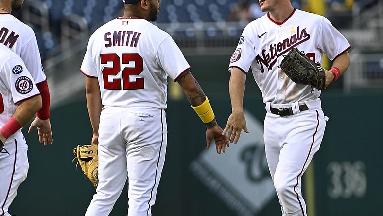 Sep 20, 2023; Washington, District of Columbia, USA; Washington Nationals first baseman Dominic Smith (22) and outfielder Jacob Young (30) celebrate after the game against the Chicago White Sox at Nationals Park. Mandatory Credit: Brad Mills-USA TODAY Sports