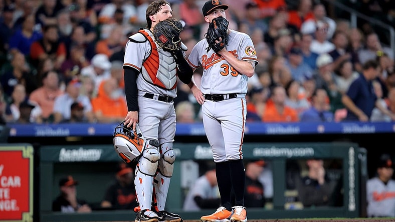 Sep 20, 2023; Houston, Texas, USA; Baltimore Orioles catcher Adley Rutschman (35) talks with Baltimore Orioles starting pitcher Kyle Bradish (39) during an umpire meeting during the sixth inning against the Houston Astros at Minute Maid Park. Mandatory Credit: Erik Williams-USA TODAY Sports
