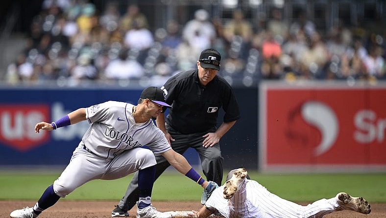Sep 20, 2023; San Diego, California, USA; San Diego Padres second baseman Matthew Batten (right) is tagged out by Colorado Rockies shortstop Ezequiel Tovar (left) attempting to steal second base during the second inning at Petco Park. Mandatory Credit: Orlando Ramirez-USA TODAY Sports