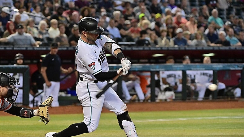 Sep 20, 2023; Phoenix, Arizona, USA;  Arizona Diamondbacks first baseman Christian Walker (53) hits a single in the third inning against the San Francisco Giants at Chase Field. Mandatory Credit: Matt Kartozian-USA TODAY Sports