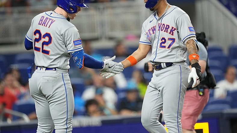 Sep 20, 2023; Miami, Florida, USA;  New York Mets designated hitter Mark Vientos (27) is congratulated by third baseman Brett Baty (22) after hitting a solo home run in the second inning against the Miami Marlins at loanDepot Park. Mandatory Credit: Jim Rassol-USA TODAY Sports