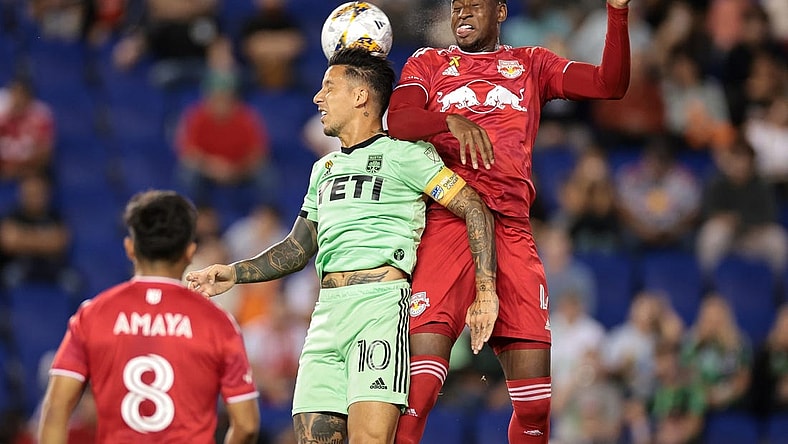Sep 20, 2023; Harrison, New Jersey, USA; Austin FC forward Sebastian Driussi (10) and New York Red Bulls defender Andres Reyes (4) jump for a header in the first half at Red Bull Arena. Mandatory Credit: Vincent Carchietta-USA TODAY Sports