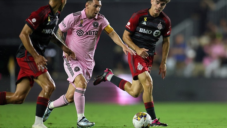 Sep 20, 2023; Fort Lauderdale, Florida, USA; Inter Miami forward Lionel Messi (10) kicks the ball past Toronto FC during the first half at DRV PNK Stadium. Mandatory Credit: Sam Navarro-USA TODAY Sports