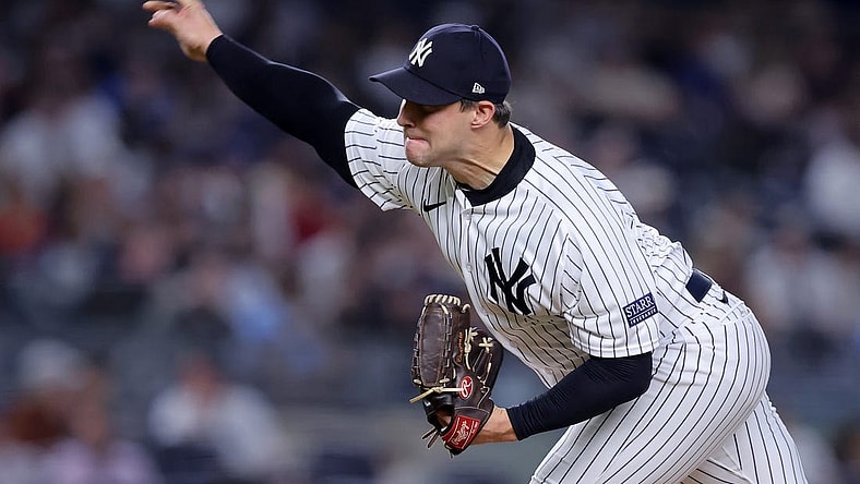 Sep 20, 2023; Bronx, New York, USA; New York Yankees relief pitcher Tommy Kahnle (41) pitches against the Toronto Blue Jays during the eighth inning at Yankee Stadium. Mandatory Credit: Brad Penner-USA TODAY Sports