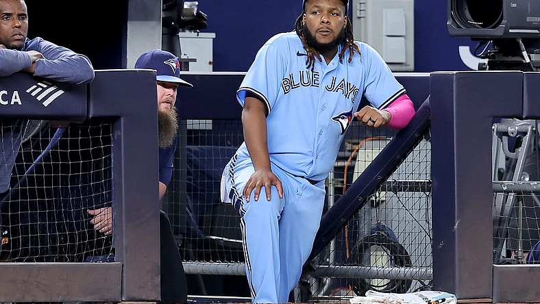 Sep 20, 2023; Bronx, New York, USA; Toronto Blue Jays designated hitter Vladimir Guerrero Jr. (27) watches from the dugout during the eighth inning against the New York Yankees at Yankee Stadium. Mandatory Credit: Brad Penner-USA TODAY Sports