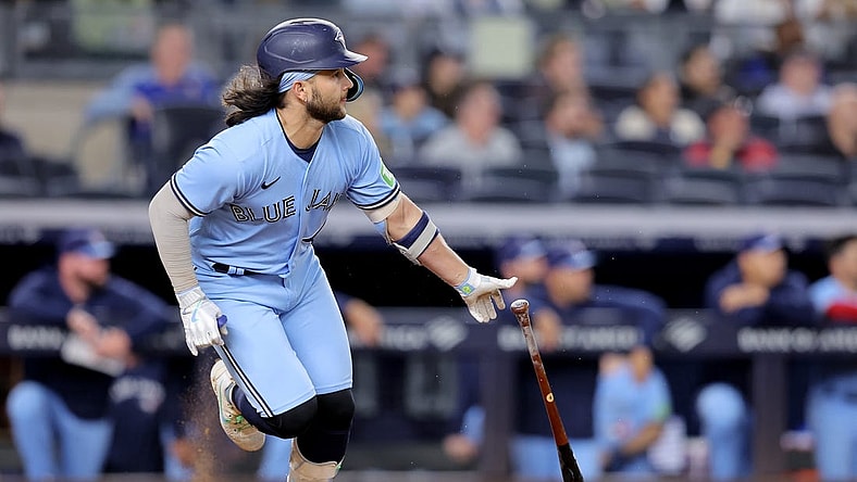 Sep 20, 2023; Bronx, New York, USA; Toronto Blue Jays shortstop Bo Bichette (11) follows through on an RBI single against the New York Yankees during the ninth inning at Yankee Stadium. Mandatory Credit: Brad Penner-USA TODAY Sports