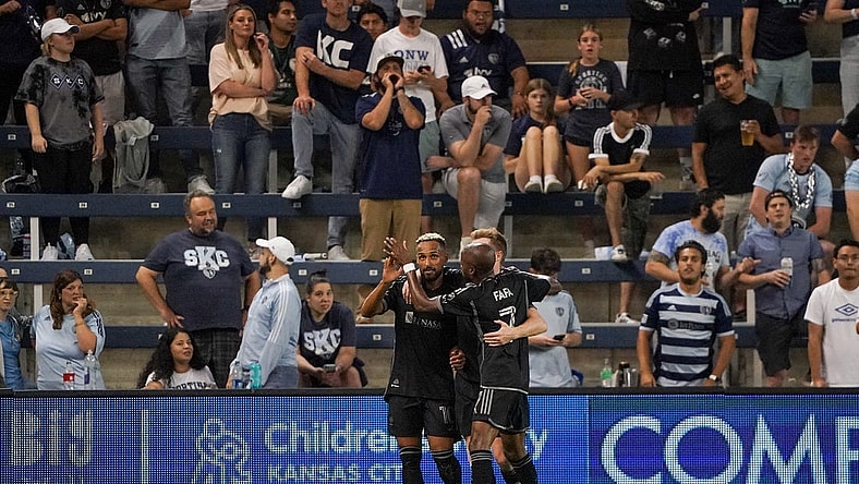 Sep 20, 2023; Kansas City, Kansas, USA; Nashville SC midfielder Hany Mukhtar (10) celebrates his goal scored against Sporting Kansas City with midfielder Dax McCarty (6) and midfielder Fafa Picault (7) during the second half at Children's Mercy Park. Mandatory Credit: Denny Medley-USA TODAY Sports