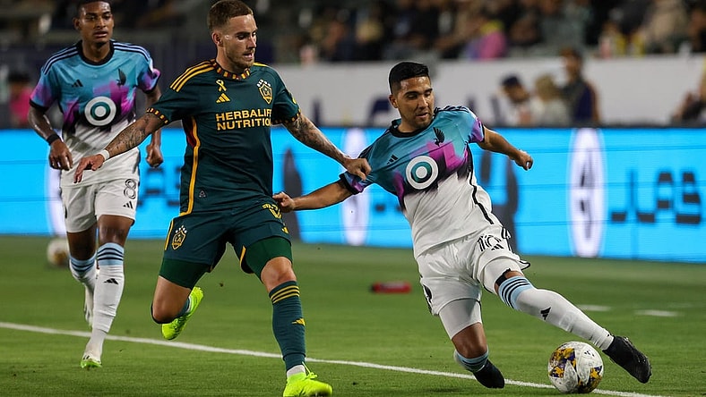 Sep 20, 2023; Carson, California, USA; Minnesota United FC midfielder Emanuel Reynoso (10) fights for the ball during the first half against Los Angeles Galaxy at Dignity Health Sports Park. Mandatory Credit: Kiyoshi Mio-USA TODAY Sports