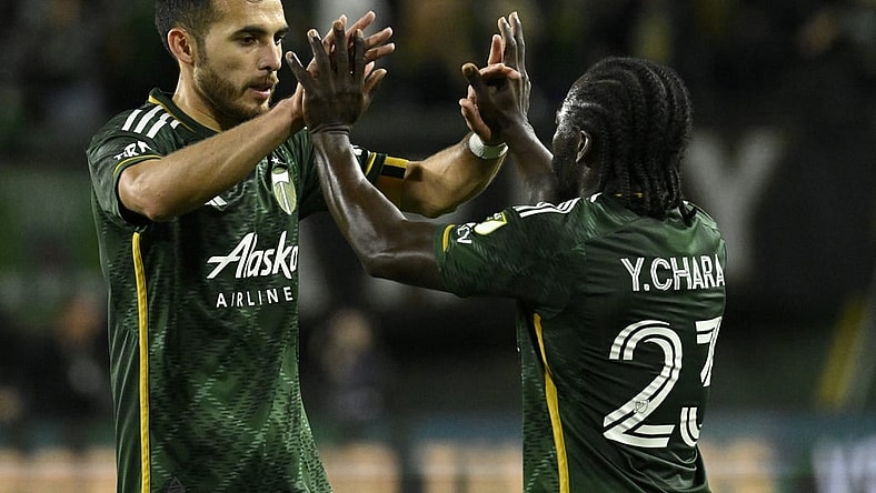 Sep 20, 2023; Portland, Oregon, USA; Portland Timbers midfielder Cristhian Paredes (22) celebrates with defender Oskar Agren (23) after the win against the San Jose Earthquakes at Providence Park. Mandatory Credit: Troy Wayrynen-USA TODAY Sports