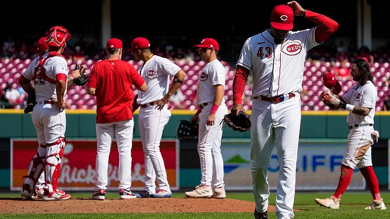 Cincinnati Reds relief pitcher Alexis Diaz (43) is pulled from the mound by manager David Bell (25) in the ninth inning of the MLB Interleague game between the Cincinnati Reds and the Minnesota Twins at Great American Ball Park in downtown Cincinnati on Wednesday, Sept. 20, 2023.