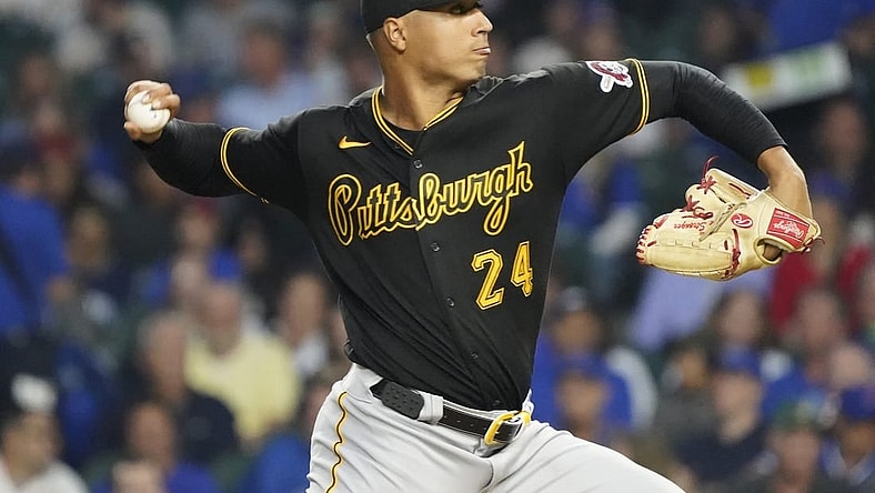 Sep 21, 2023; Chicago, Illinois, USA; Pittsburgh Pirates starting pitcher Johan Oviedo (24) throws the ball against the Chicago Cubs during the first inning at Wrigley Field. Mandatory Credit: David Banks-USA TODAY Sports