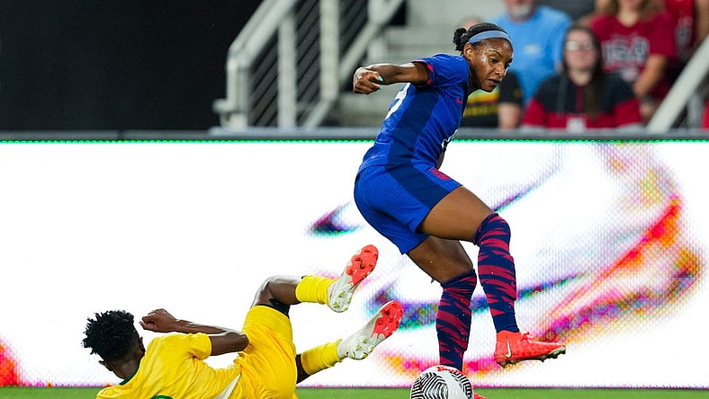 Sep 21, 2023; Cincinnati, Ohio, USA;  United States defender Crystal Dunn (19) dribbles the ball against South Africa defender Lebogang Ramalepe (2) in the first half at TQL Stadium. Mandatory Credit: Aaron Doster-USA TODAY Sports