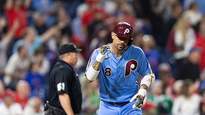 Sep 21, 2023; Philadelphia, Pennsylvania, USA; Philadelphia Phillies right fielder Nick Castellanos (8) tosses his bat after hitting a home run during the sixth inning against the New York Mets at Citizens Bank Park. Mandatory Credit: Bill Streicher-USA TODAY Sports