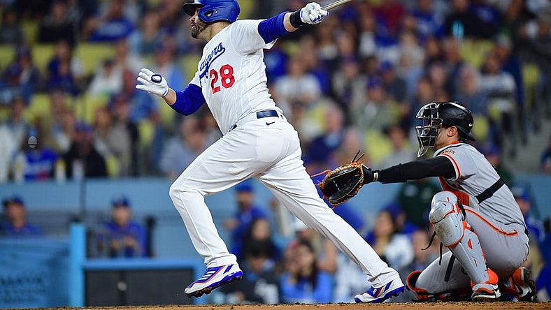 Sep 21, 2023; Los Angeles, California, USA; Los Angeles Dodgers designated hitter J.D. Martinez (28) hits a solo home run against the San Francisco Giants during the fourth inning at Dodger Stadium. Mandatory Credit: Gary A. Vasquez-USA TODAY Sports