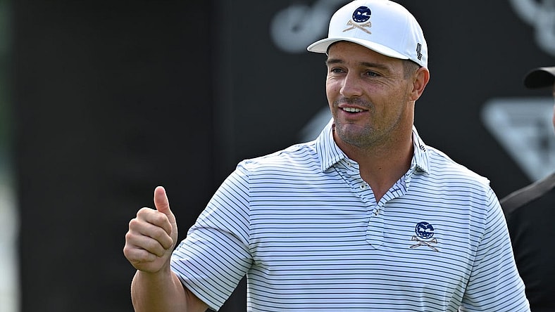 Sep 22, 2023; Sugar Grove, Illinois, USA; Bryson DeChambeau interacts with fans while warming up during the first round of the LIV Golf Chicago golf tournament at Rich Harvest Farms. Mandatory Credit: Jamie Sabau-USA TODAY Sports