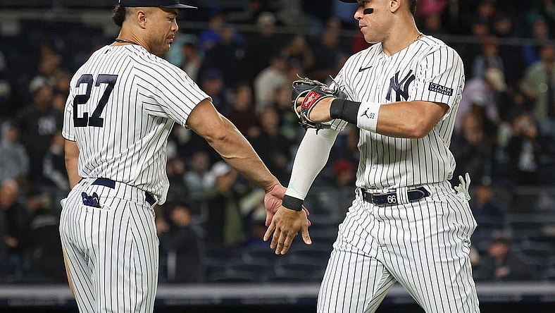 Sep 22, 2023; Bronx, New York, USA; New York Yankees right fielder Aaron Judge (99) celebrates with designated hitter Giancarlo Stanton (27) after defeating the Arizona Diamondbacks at Yankee Stadium. Mandatory Credit: Vincent Carchietta-USA TODAY Sports