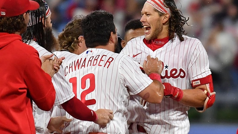 Sep 22, 2023; Philadelphia, Pennsylvania, USA; Philadelphia Phillies first baseman Alec Bohm (28) celebrates his walk-off single with teammates during the tenth inning against the New York Mets at Citizens Bank Park. Mandatory Credit: Eric Hartline-USA TODAY Sports