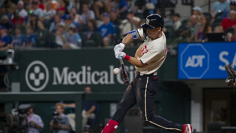Sep 22, 2023; Arlington, Texas, USA; Texas Rangers center fielder left Carter (32) bats against the Seattle Mariners during the game at Globe Life Field. Mandatory Credit: Jerome Miron-USA TODAY Sports