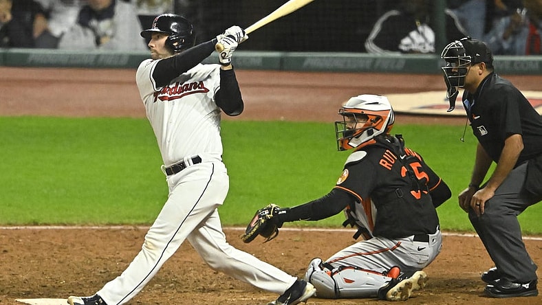 Sep 22, 2023; Cleveland, Ohio, USA; Cleveland Guardians catcher David Fry (12) hits a game-winning, two-RBI double in the ninth inning against the Baltimore Orioles at Progressive Field. Mandatory Credit: David Richard-USA TODAY Sports