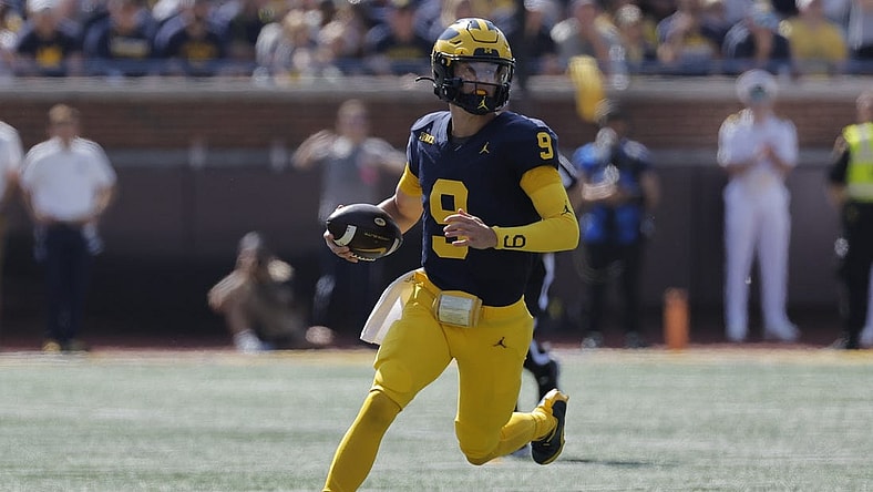 Sep 23, 2023; Ann Arbor, Michigan, USA;  Michigan Wolverines quarterback J.J. McCarthy (9) runs the ball against the Rutgers Scarlet Knights in the first half at Michigan Stadium. Mandatory Credit: Rick Osentoski-USA TODAY Sports