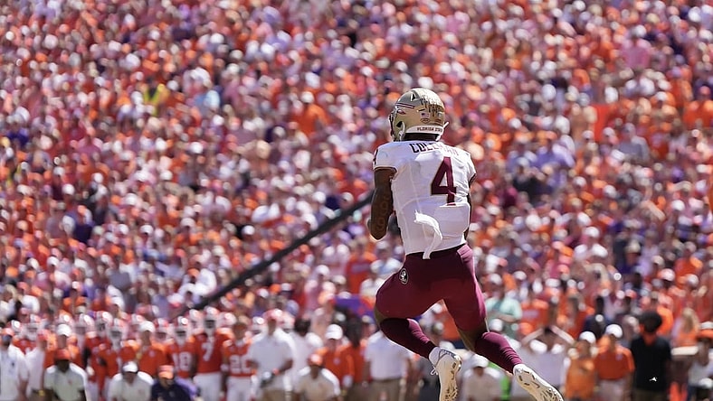 Sep 23, 2023; Clemson, South Carolina, USA; Florida State Seminoles wide receiver Keon Coleman (4) catches a touchdown pass in the first half against the Clemson Tigers at Memorial Stadium. Mandatory Credit: David Yeazell-USA TODAY Sports