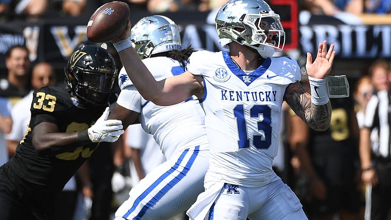 Sep 23, 2023; Nashville, Tennessee, USA; Kentucky Wildcats quarterback Devin Leary (13) throws a pass against the Vanderbilt Commodores during the first half at FirstBank Stadium. Mandatory Credit: Christopher Hanewinckel-USA TODAY Sports
