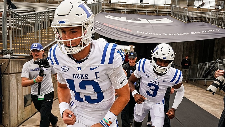 Sep 23, 2023; East Hartford, Connecticut, USA; Duke Blue Devils quarterback Riley Leonard (13) heads onto the field to warm up before the start of the game against the UConn Huskies at Rentschler Field at Pratt & Whitney Stadium. Mandatory Credit: David Butler II-USA TODAY Sports