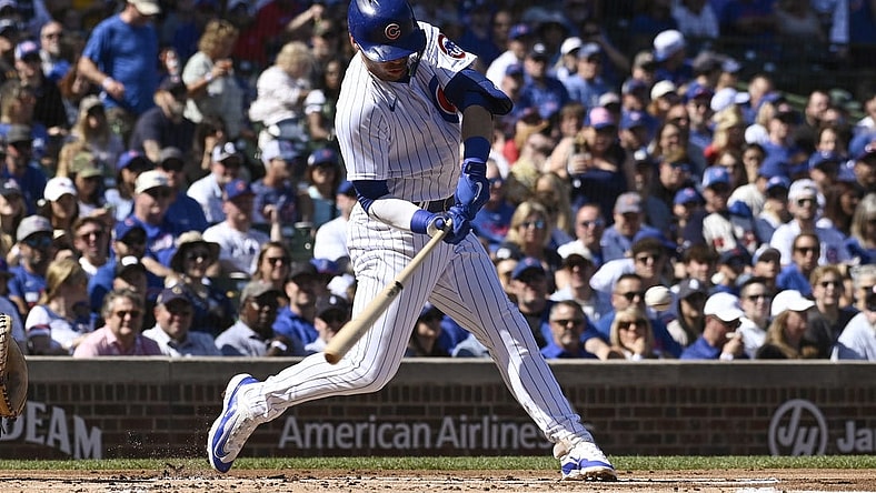 Sep 23, 2023; Chicago, Illinois, USA; Chicago Cubs second baseman Nico Hoerner (2) hits a single against the Colorado Rockies during the first inning at Wrigley Field. Mandatory Credit: Matt Marton-USA TODAY Sports