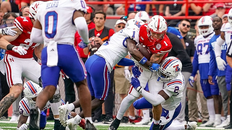 Sep 23, 2023; Lincoln, Nebraska, USA; Nebraska Cornhuskers wide receiver Billy Kemp IV (1) runs against Louisiana Tech Bulldogs defensive back Cecil Singleton Jr. (2) and defensive back Willie Roberts (1) during the first quarter at Memorial Stadium. Mandatory Credit: Dylan Widger-USA TODAY Sports