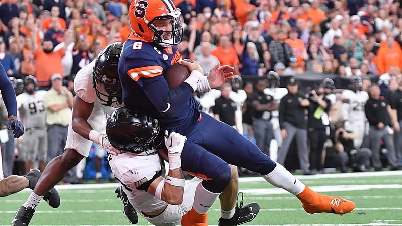 Sep 23, 2023; Syracuse, New York, USA; Syracuse Orange quarterback Garrett Shrader (6) scores a rushing touchdown against the Army Black Knights in the fourth quarter at the JMA Wireless Dome. Mandatory Credit: Mark Konezny-USA TODAY Sports