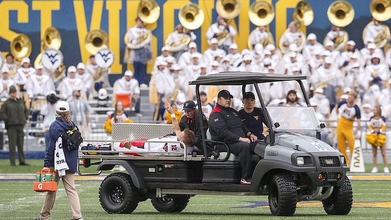 Sep 23, 2023; Morgantown, West Virginia, USA; Texas Tech Red Raiders quarterback Tyler Shough (12) gestures as he is carted off the field after an injury during the first quarter against the West Virginia Mountaineers at Mountaineer Field at Milan Puskar Stadium. Mandatory Credit: Ben Queen-USA TODAY Sports