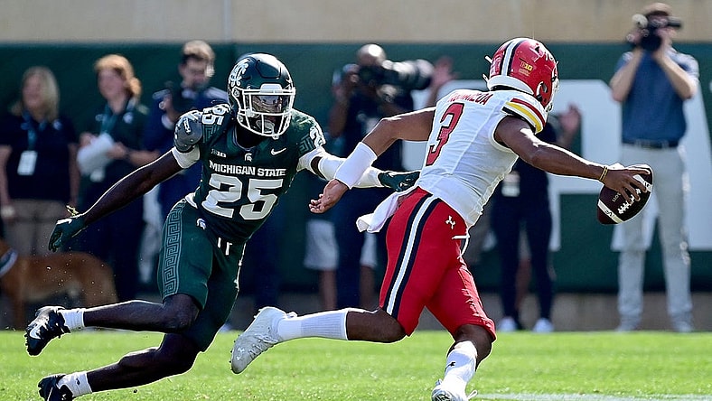 Sep 23, 2023; East Lansing, Michigan, USA;  Michigan State Spartans defensive back Chance Rucker (25) chases Maryland Terrapins quarterback Taulia Tagovailoa (3) out of the pocket in the first quarter at Spartan Stadium. Mandatory Credit: Dale Young-USA TODAY Sports