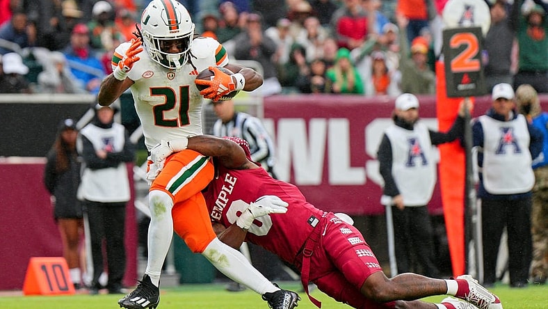 Sep 23, 2023; Philadelphia, Pennsylvania, USA;  Temple Owls safety Alex Odom (8) can   t stop Miami Hurricanes running back Henry Parrish Jr. (21) from scoring a touchdown in the second half against the Temple Owls at Lincoln Financial Field. Mandatory Credit: Andy Lewis-USA TODAY Sports