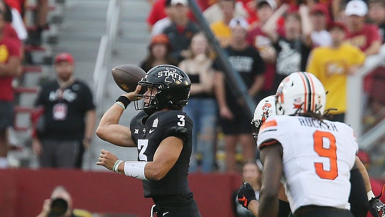Iowa State Cyclones' quarterback Rocco Becht (3) passes the ball around Oklahoma State Cowboys' safety Trey Rucker (9)during the first quarter of an NCAA college football game at Jack Trice Stadium on Saturday, Sept. 23, 2023, in Ames, Iowa.