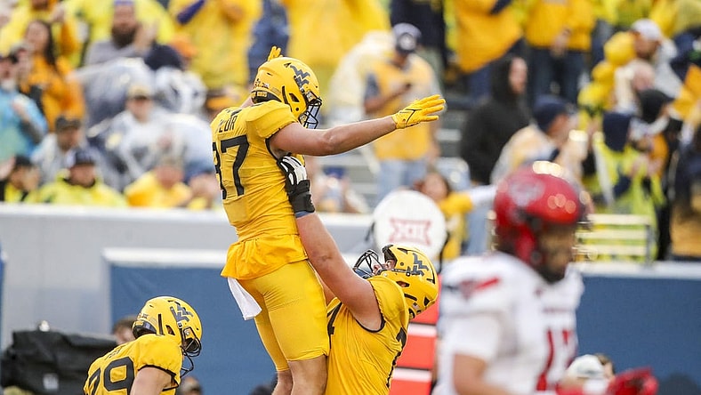 Sep 23, 2023; Morgantown, West Virginia, USA; West Virginia Mountaineers tight end Kole Taylor (87) celebrates with teammates after catching a pass for a touchdown against the Texas Tech Red Raiders during the fourth quarter at Mountaineer Field at Milan Puskar Stadium. Mandatory Credit: Ben Queen-USA TODAY Sports