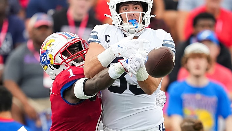 Sep 23, 2023; Lawrence, Kansas, USA; Kansas Jayhawks safety Kenny Logan Jr. (1) breaks up a pass intended for Brigham Young Cougars tight end Isaac Rex (83) during the first half at David Booth Kansas Memorial Stadium. Mandatory Credit: Jay Biggerstaff-USA TODAY Sports
